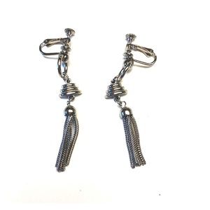 Silver drop earrings by Roget.  Screw back.